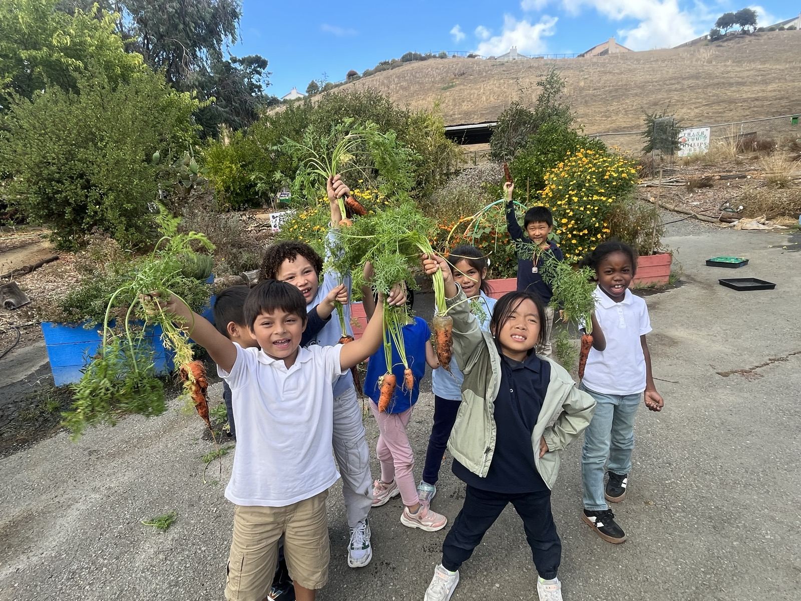 students with a big harvest